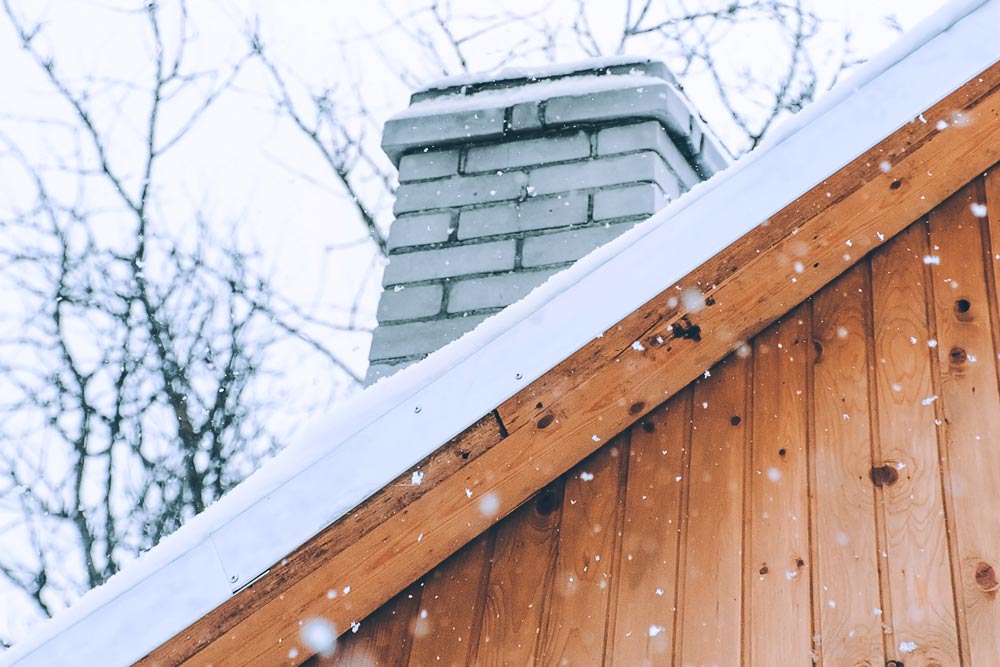 Snowfall on a wooden roof