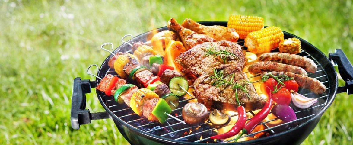 A griller with smoke placed outside in garden