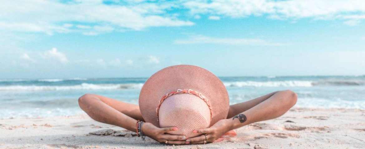 A lady laying on beach