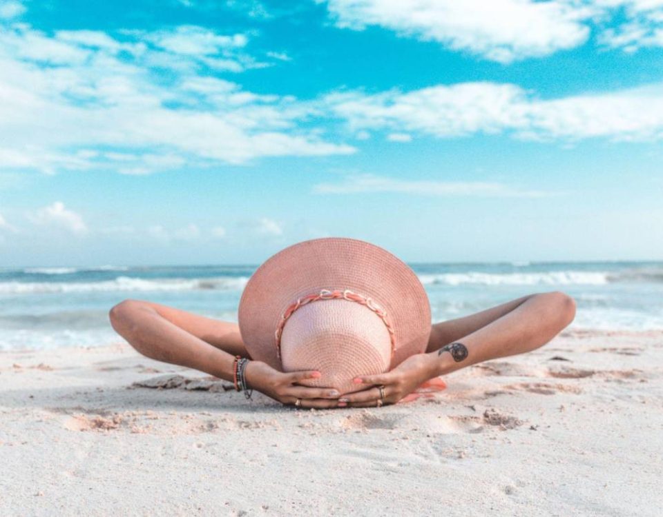 A lady laying on beach